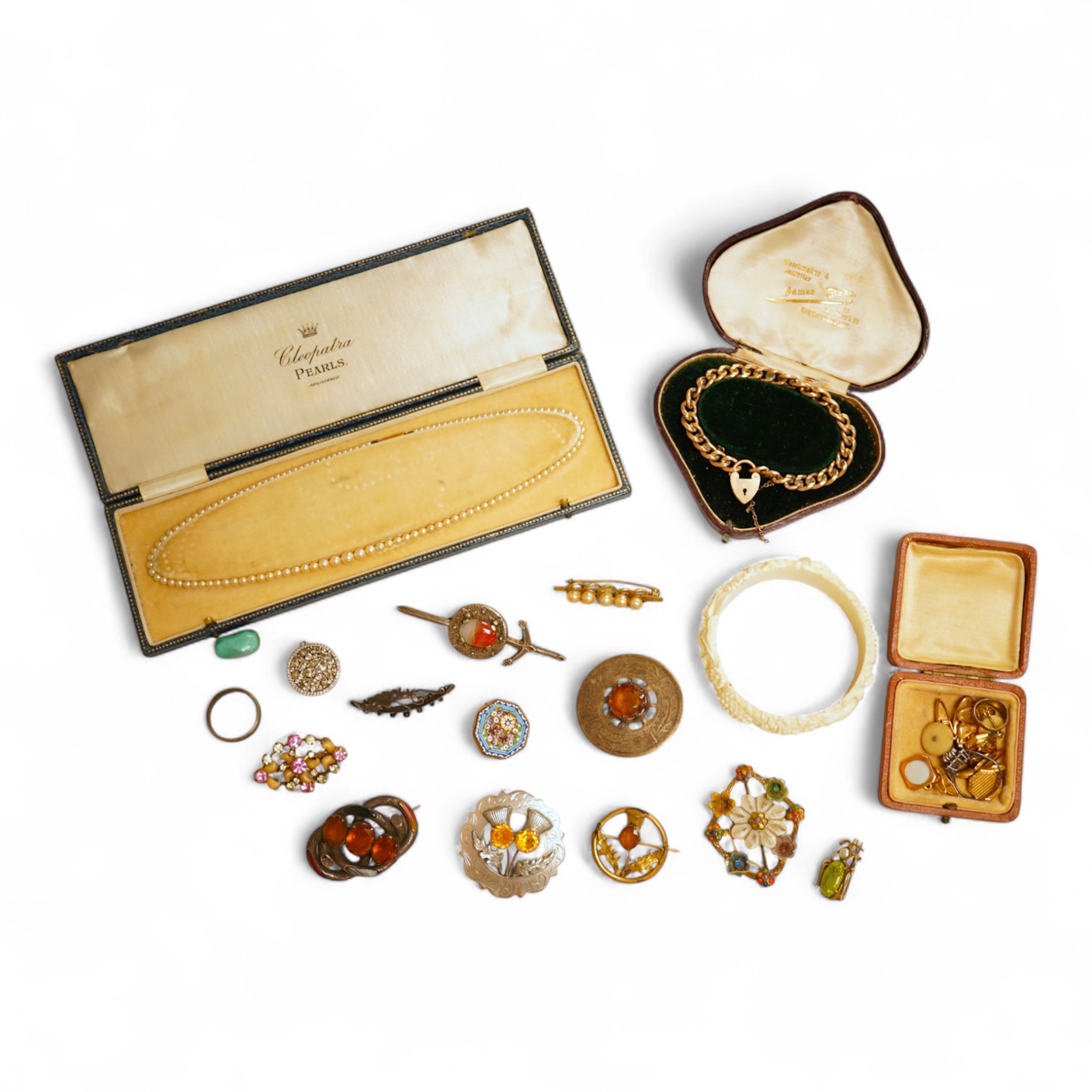 A small group of assorted jewellery including a gold plated curb link bracelet, silver brooch, simulated pearl necklace and costume.